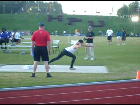 Ben Shot Putting with a Guy in the way