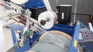 Rewinding line with semi-automatic spooler