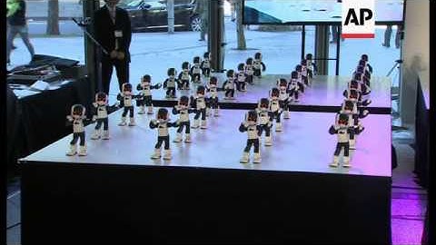 100 mini humanoids perform dance routine