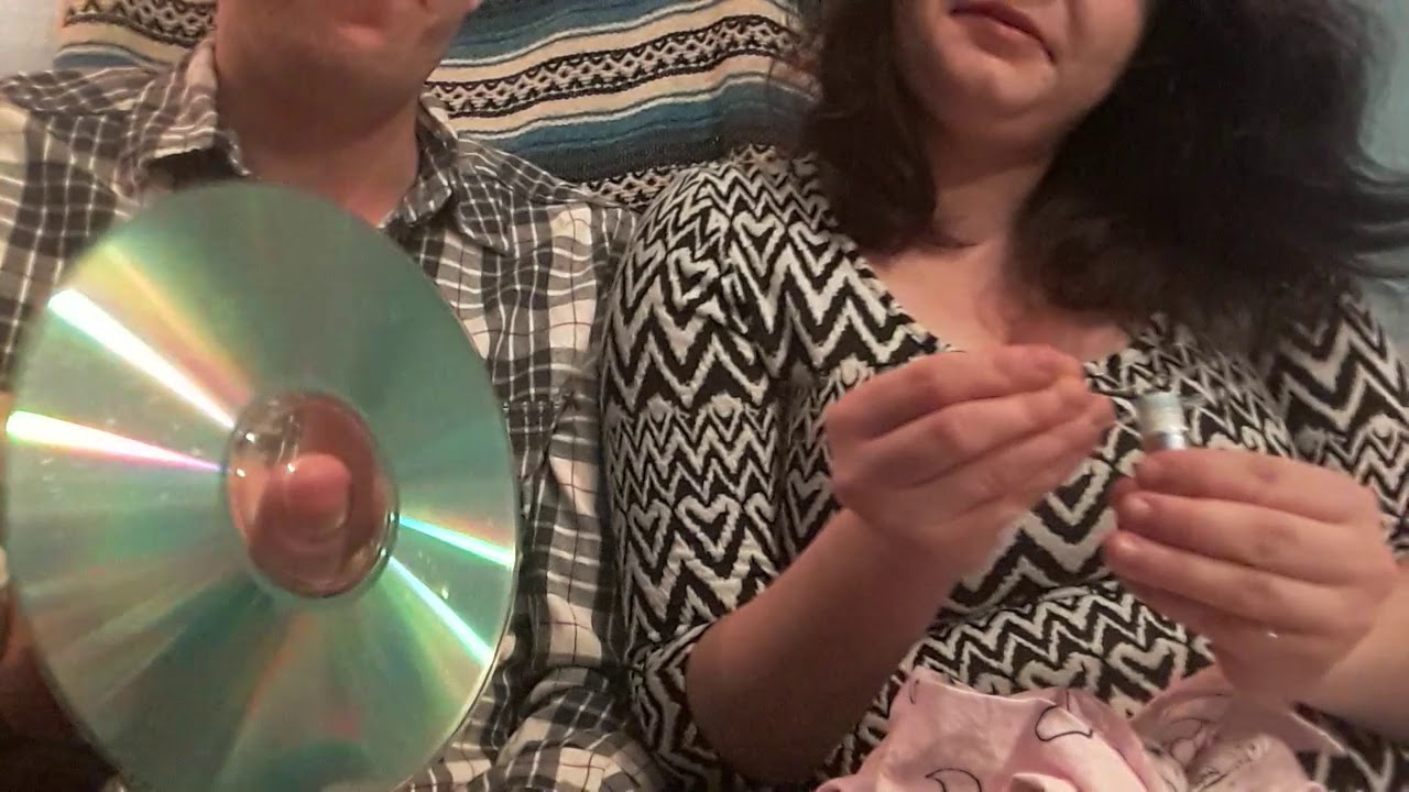 Sneezing on a CD (first real video) M+F