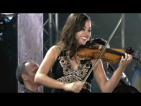 Mary Simspon performs with her joyful smile on Yanni's The Rain Must Fall
