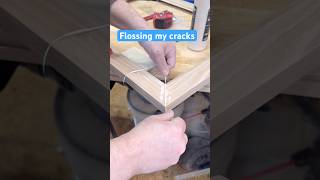 Using dental floss to push glue into a crack or thin kerf #workshop #woodworking #woodglue