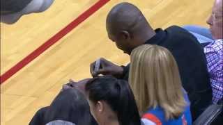 rockets fan catches hakeem autographed ball gives to kid