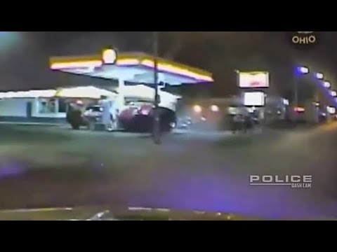 Dashcam Police Chase Ends in accident at Gas Station.