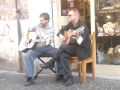 Bono singing on the street in Rome
