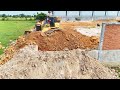Perfectly Bulldozer Pushing Soil, Dump trucks Pour soil to clear the foundation of the wall complete