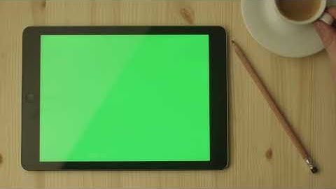 Green Screen | Chroma Key | tablet with green screen laying on a wooden table | 4K | HD