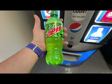 Buying a soda from a small vending machine