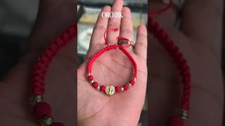 pulsera Balines Oro18K y san Benito hilo rojo