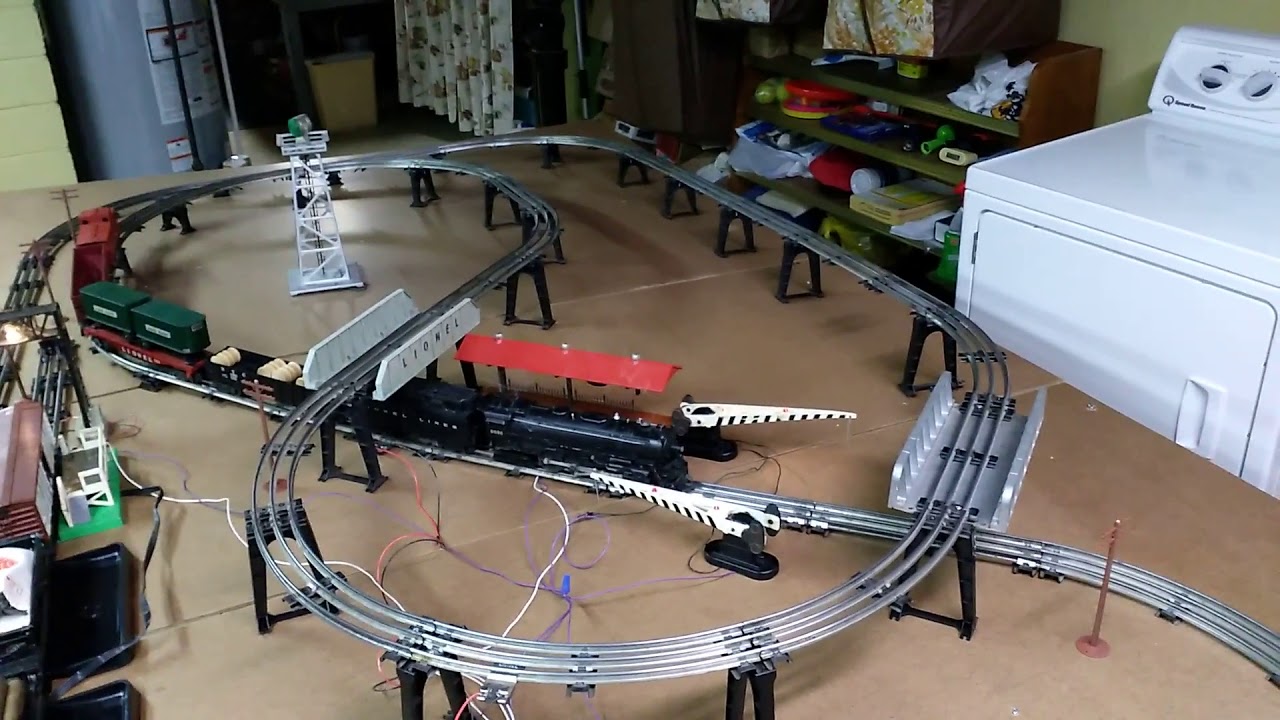 Vintage postwar Lionel 5x9 elevated train set with operating cars and