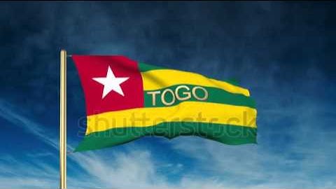 Togo flag slider style with title. Waving in the wind with cloud background animation Stock video