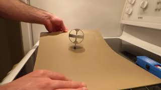 Regular Gyroscope Tossed on Low Friction Surface Magically is Unaffected