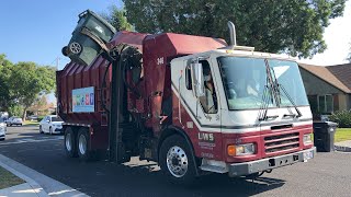 Universal waste systems: UWS condor Octo Amrep Garbage truck on yard waste