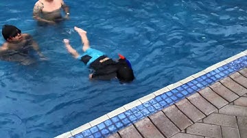 Getting braver in the water - this is a 1.25-1.4m deep swimming pool