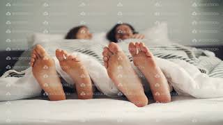 Human Feet Moving In Bed In Funny Rhythm, Couple Having Fun In Bedroom