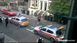 Amateur video of Machete weilding man being tackled by police with a wheelie bin