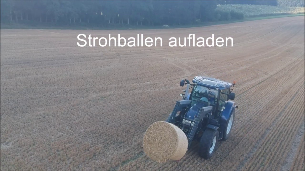 Strohballen aufladen mit New Holland T6