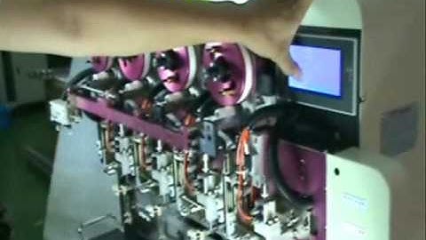 TM-1604 FOUR SPINDLE AUTOMATIC TAPING MACHINE