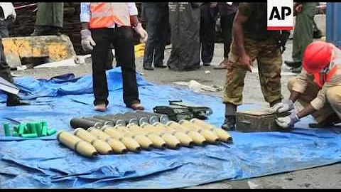 Authorities show off seized weapons, including artillery