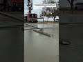 Professional Concrete Slab Finishing with Long-Handle Power Screed