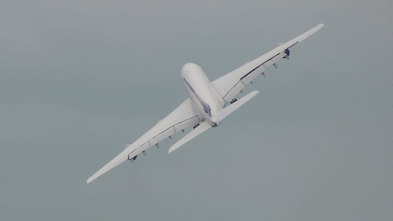 Extrem waving Lufthansa Airbus A380 D-AIMJ take off for delivery at Hamburg Finkenwerder