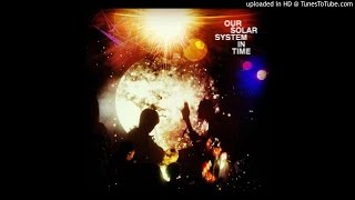 Our Solar System - In the Beginning of Time
In Time 2016
https://beyondbeyondisbeyondrecords.bandcamp.com/album/in-time
https://www.facebook.com/onlyoneruleoursolarsystem/?fref=nf
https://www.facebook.com/beyondbeyondisbeyond
http://beyondbeyondisbeyond.com/store
Bigband freeform psychedelic folk-doom dream-beat
There would seem to be something playful, and possibly deceptive, about the title of Our Solar System’s second album, “In Time.” It’s a phrase that, whether in a musical or even an appropriately astrological sense, indicates confines and regular rotations, even the absence of the abnormal. Yet “abnormal” could be the axis around which all planets in the Our Solar System galaxy revolve. For an album that so effortlessly delivers trance states in sound, the effect of “In Time” on the listener is likely to be one of orbiting far beyond those confines and regular rotations, toward a delirious detachment from the ticking trap of time.
“In Time” is essentially the work of thirty hands, creating two side-length tracks and forty-four minutes of sonic energy that serves as a vehicle to reach peak experience, alternately arriving and departing from control and abandon.
“In the Beginning of Time” is the title of side one, and appropriately, the twin engines of jazz and kosmische that power Our Solar System’s flight are apparent from the very start. Saxophone merges with synth, as a bass line slowly, stoically stands behind, ready to assist the emerging journey. “In the Beginning of Time” feels like an invocation, and to be clear, it is absolutely nothing less. Our Solar System seem interested in building bridges between worlds, and not just the already quite connected worlds of jazz, progressive rock and psychedelia – labels that represent the previously mentioned confines and regular rotations to which “In Time” pays little heed. Twelve minutes in to “In the Beginning of Time,” such barriers have fallen away, scorched by the altitude and free trajectory of Our Solar System’s flight. “At the Edge of Time” is the album’s cosmic co-conspirator, slightly longer, slightly odder, and slightly more seductive, in part given the mantra-like vocals that provide calm contrast to the musical meteor shower that’s crashing around them. This is the sound of Our Solar System at their astrological apex – exploratory, transcendent and joyous.
Within the confines of time, it’s appropriate to refer to “In Time” as an interstellar jazz-rock album, and an extraordinary one at that. Despite it’s title, you may come to believe that the true home of “In Time” is a place outside time’s confines, floating in space, surrounded by infinite stars and sounds, projecting an indefinable sound that’s boundless and beautiful.
- revoltoftheapes.com
-Video Upload powered by https://www.TunesToTube.com Our Solar System - In the Beginning of Time