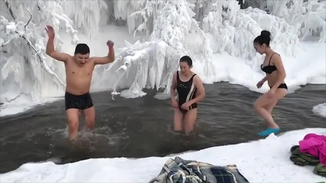 Brrr-ave tourists bathe in river in world&#39;s coldest village - YouTube