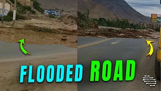 Floods Slowly Covering a Road as People Try to Keep Their Distance