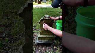 Cleaning the grave of Henry Simpson
