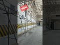 Proper installation of scaffoldings on high ceiling works while lower area still passable.(1)