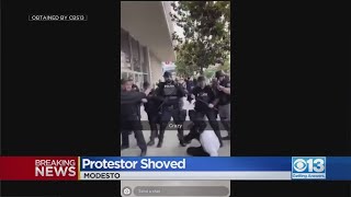 Protester Shoved In Modesto