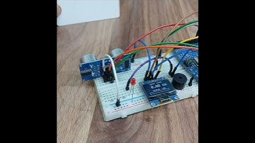 Efficient Water Tank Management System Real-Time Level Monitoring with OLED Display and Smart Alerts