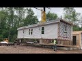 July 25 2022 second view of modular house being set from ground level.