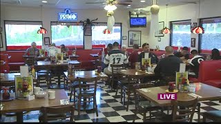 Police officers connect with community during National Coffee with a Cop Day