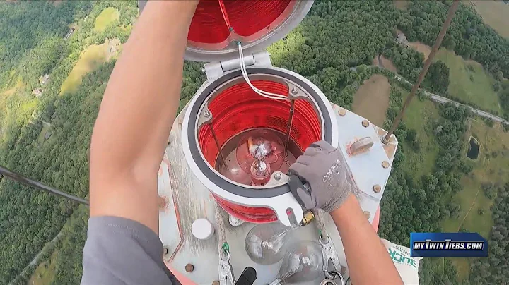 Crew changes lightbulbs in WETM's 800-foot transmit tower