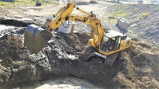 Komatsu PC300 Excavator Working On River Dam Construction