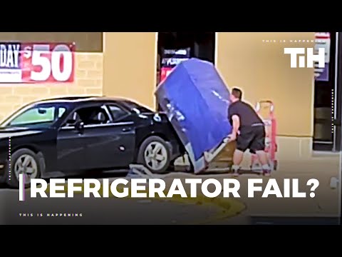 Guy Single-Handedly Loads Refrigerator on top of his Car's Sedan