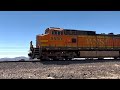 BNSF Dash-9 leads a long well car freight train through the Arizona desert