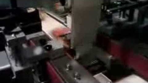 BakeryMachinery.net Clam Shell Container Top and Bottom Label Applicator