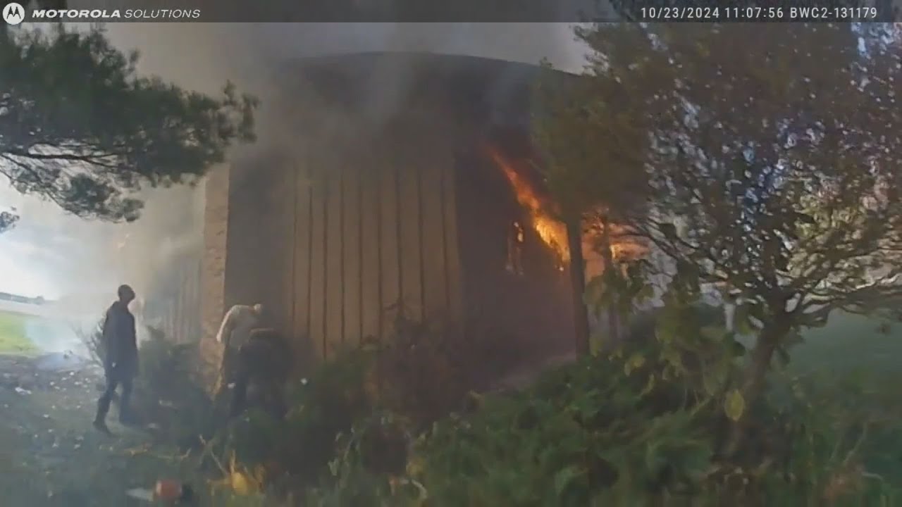 BODYCAM | First responders rescue trapped woman from burning house in ...