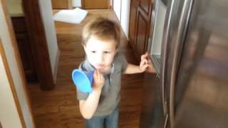 Young Boy Drinks Water Through Funnel