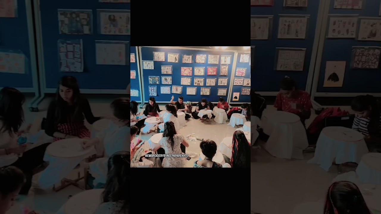 Students learning Aariwork.