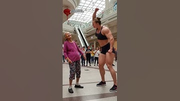 A strong woman wants to bully the thin old lady, but she didn