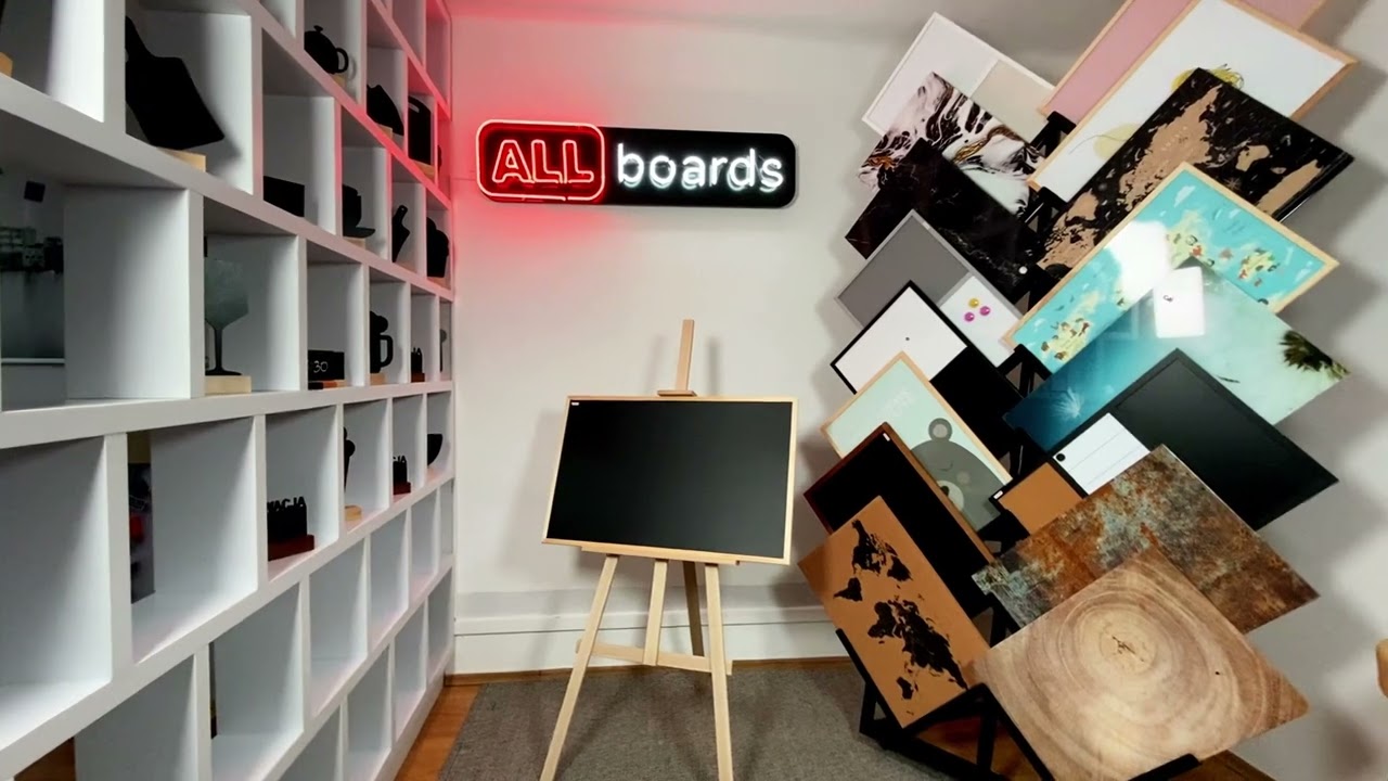 Black magnetic chalkboard in wooden frame