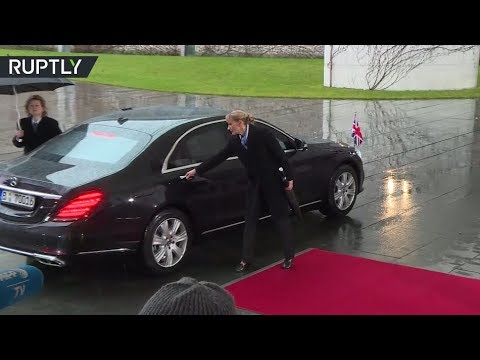 She can't (Br)exit her car either? Theresa May gets locked in vehicle before Merkel meeting