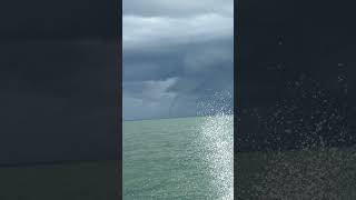 Double Waterspouts Emerge From Storm Clouds