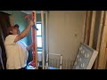 Homestead mobile home bathtub to walk in shower remodel pt8 building the next wall /kitchen cabinets