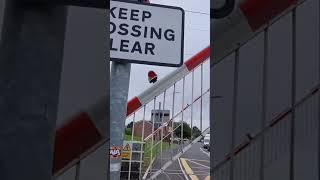 class 168 110 passes Noose Lane level crossing with a tone