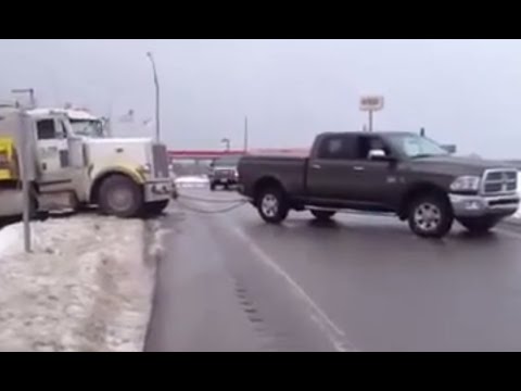 Ram pulls out loaded tractor trailer from ditch - YouTube