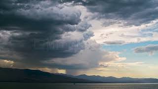 Stock Video - Timelapse of clouds and dust storm moving over Utah Lake